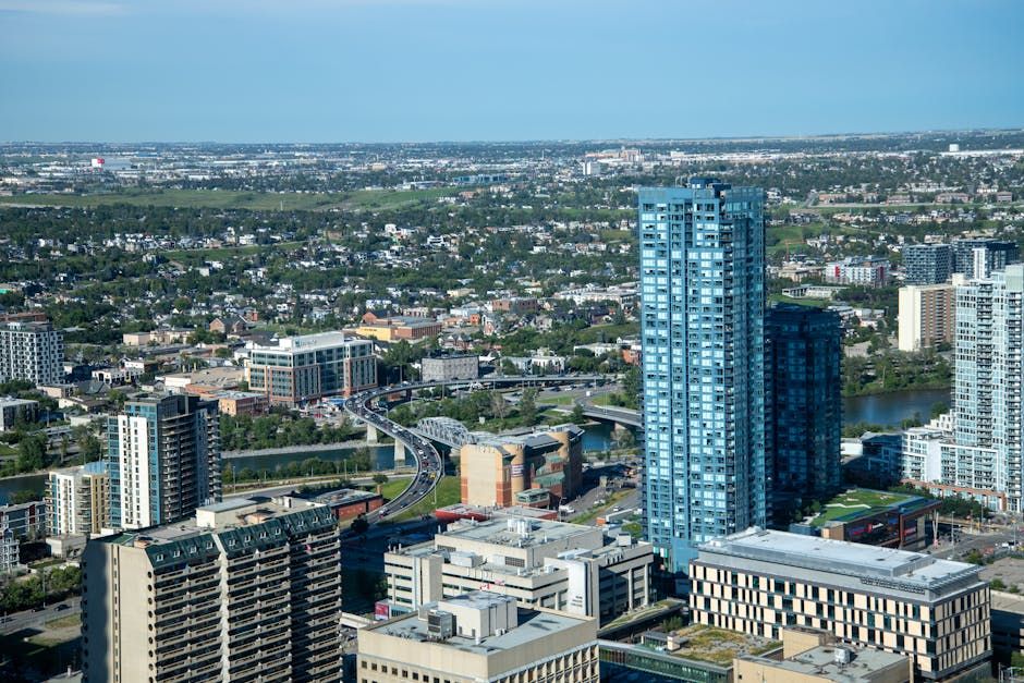 Aerial view of Calgary at dusk showing the city spread across its four quadrants